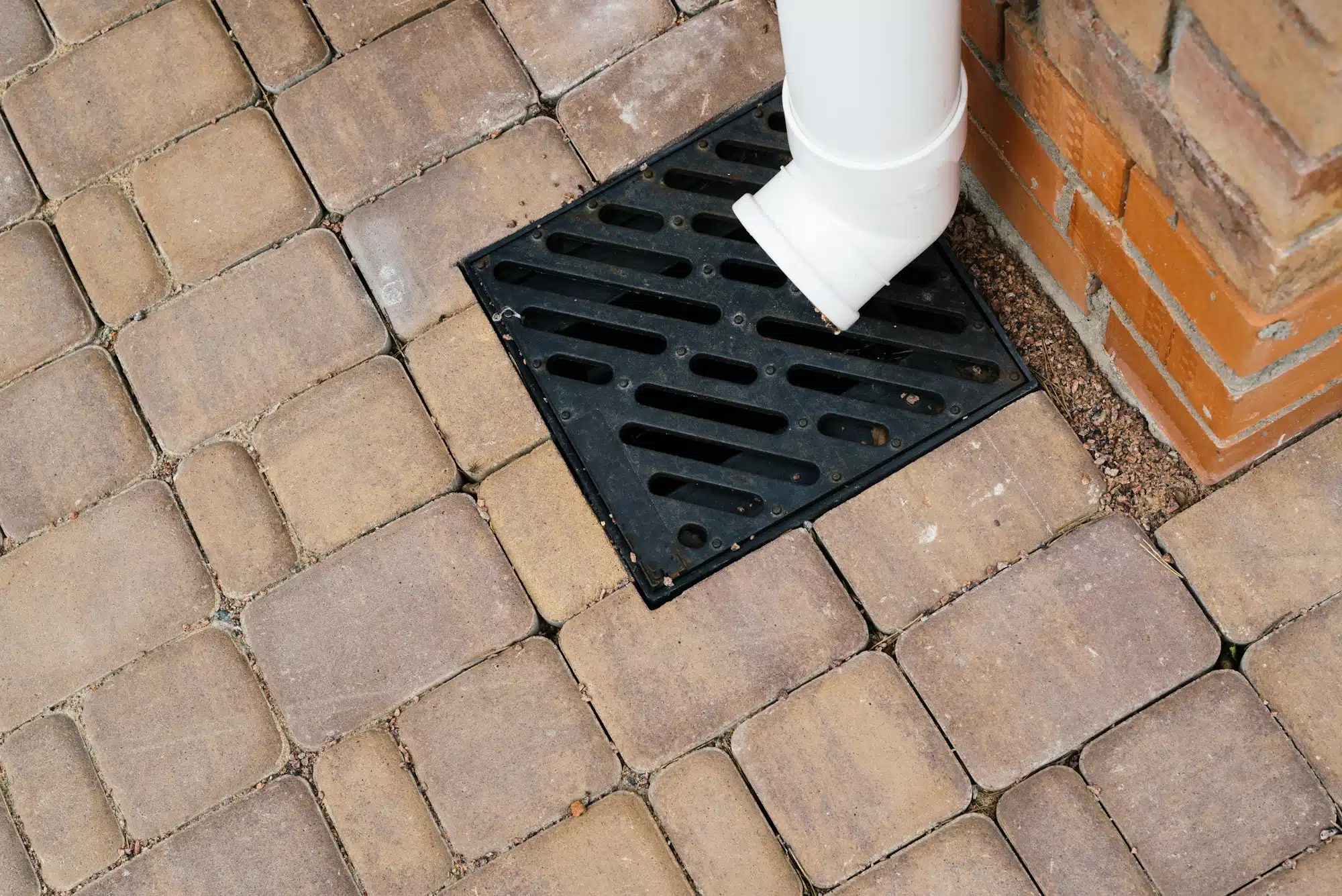 Stormwater cast iron drainage system in a pavement. Is used for drainage and separation of water